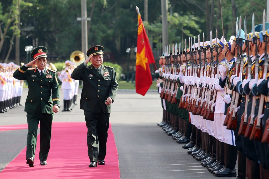 Vietnamese Defence Minister Phan Van Giang (left) and Chinese military commander Zhang Youxia review a guard of honour in Hanoi on October 24. Photo: EPA-EFE Vietnamese Defence Minister Phan Van Giang (left) and Chinese military commander Zhang Youxia review a guard of honour in Hanoi on October 24. Photo: EPA-EFE