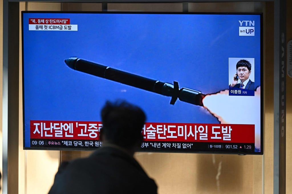 A man watches a television screen showing a news broadcast with file footage of a North Korean missile test, at a railway station in Seoul on Thursday. Photo: AFP