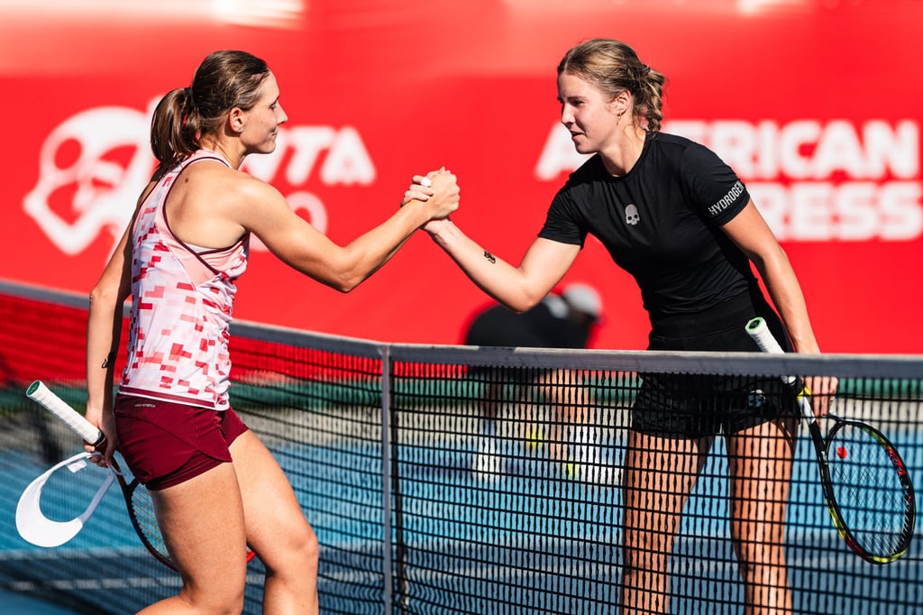 Varvara Gracheva (left) and Anastasia Zakharova shake hands after their last 16 match. Photo: HKTCA