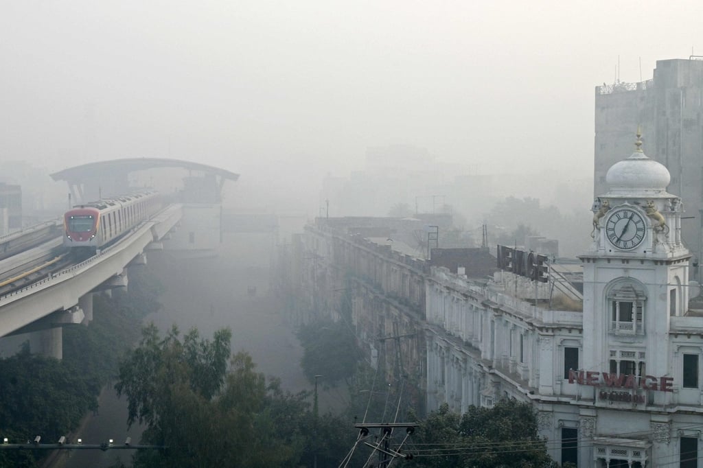 An Orange Line Metro Train (OLMT) on an elevated track amid smoggy conditions in Lahore on Sunday. Photo: AFP
