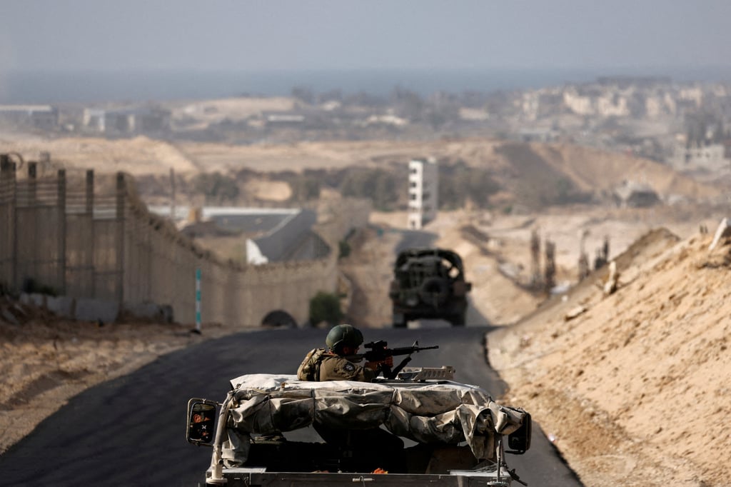 Israeli military vehicles drive through the Philadelphi corridor in southern Gaza. Photo: Reuters