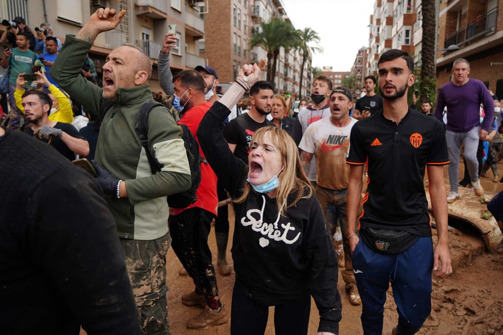 Angry residents during the king’s visit. Photo: AFP Angry residents during the king’s visit. Photo: AFP