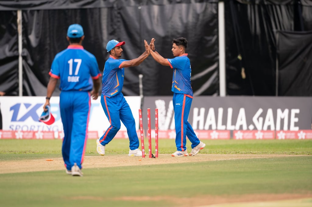 Pratish is congratulated by his teammates after taking another wicket at the Hong Kong Cricket Sixes. Photo: CHKC Pratish is congratulated by his teammates after taking another wicket at the Hong Kong Cricket Sixes. Photo: CHKC