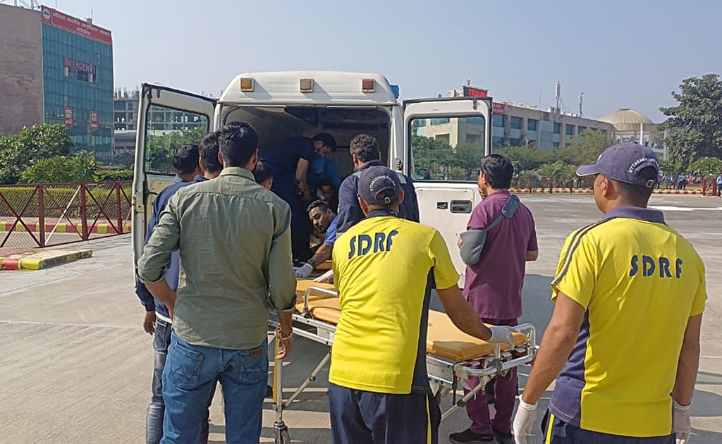 India’s State Disaster Response Force (SDRF) members shift an injured person into an ambulance after a bus fell into a gorge in Uttarakhand’s Almora District on Monday. Photo: State Disaster Response Force / EPA-EFE
