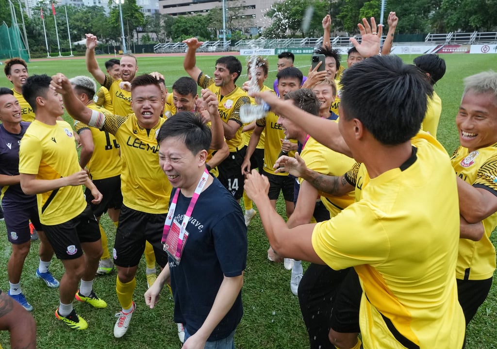 Norman Lee in the middle of Lee Man’s on-pitch party after capturing the title. Photo: Elson Li