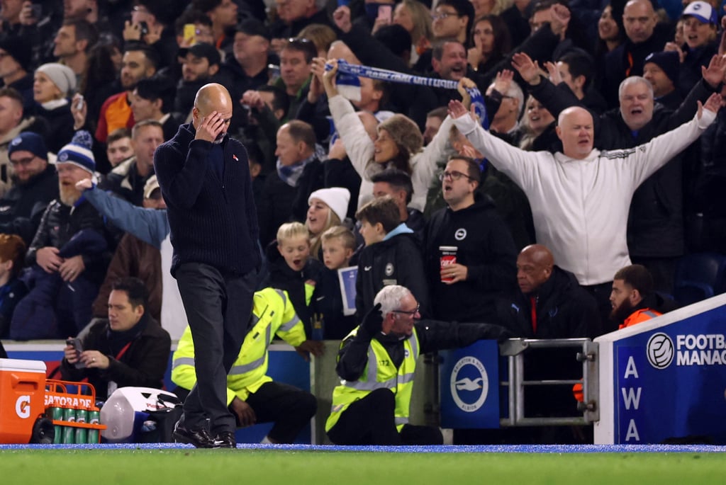 Manchester City manager Pep Guardiola can’t bear to watch as his side lose to Brighton. Photo: Reuters Manchester City manager Pep Guardiola can’t bear to watch as his side lose to Brighton. Photo: Reuters