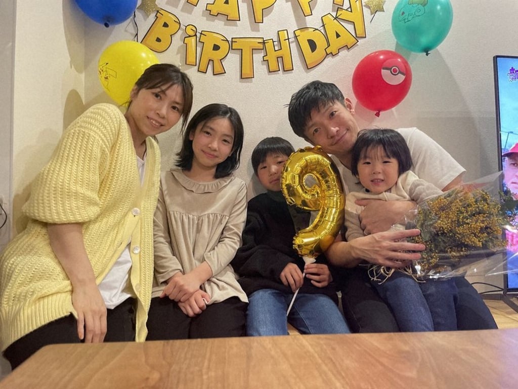 Police officer Keisuke Oma with the family he lost in the powerful earthquake. Photo: Interviewee