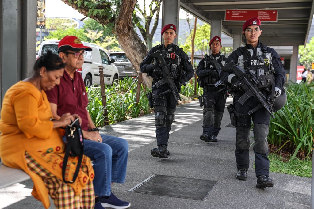 Armed police officers patrol before a mass led by Pope Francis in Singapore in September. Photo: EPA-EFE Armed police officers patrol before a mass led by Pope Francis in Singapore in September. Photo: EPA-EFE