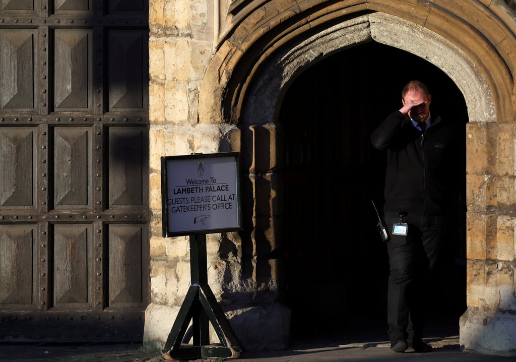 An employee stands at an entrance to Lambeth Palace, the official residence in London of the Archbishop of Canterbury, Justin Welby. Photo: Reuters An employee stands at an entrance to Lambeth Palace, the official residence in London of the Archbishop of Canterbury, Justin Welby. Photo: Reuters