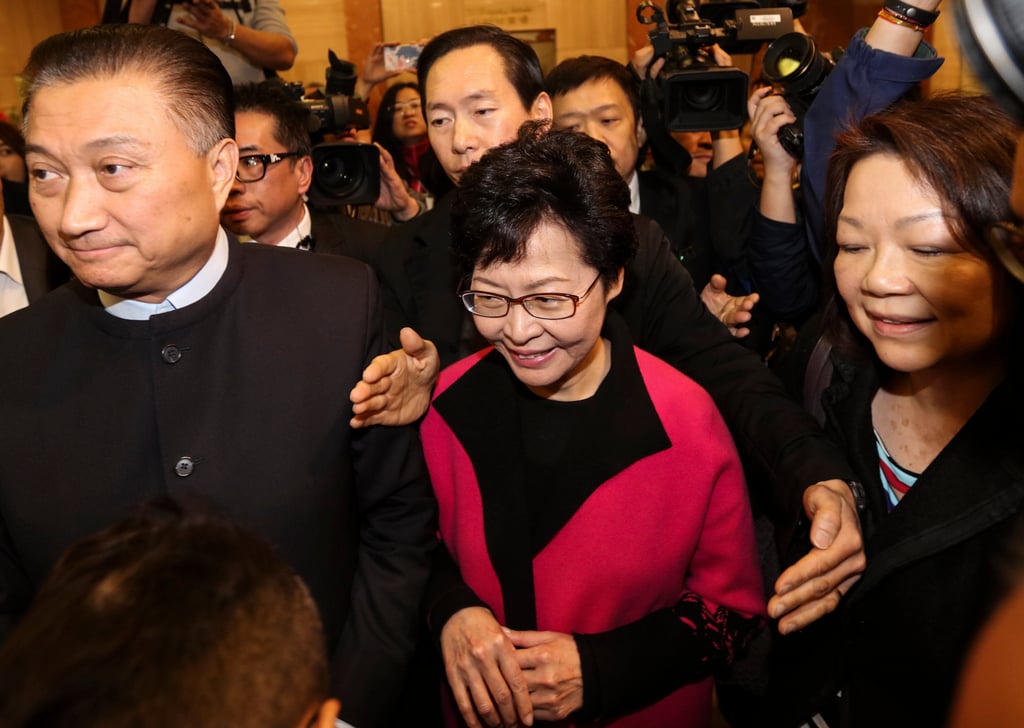 Bunny Chan (left) accompanies Carrie Lam (centre) to the Electoral Affairs Commission in Wan Chai to submit the nomination form for the Chief Executive election in February 2017. Photo: Felix Wong