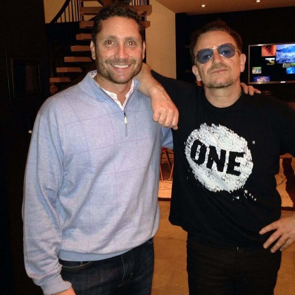 Bethenny Frankel’s beau Tom Villante, pictured here with U2’s Bono, is a businessman. Photo: Tom Villante/Facebook