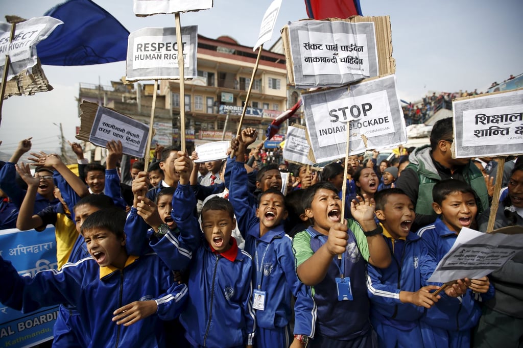 Nepalese students holding placards take part in a protest to show solidarity against the border blockade in Kathmandu, Nepal in November 2015. Photo: Reuters Nepalese students holding placards take part in a protest to show solidarity against the border blockade in Kathmandu, Nepal in November 2015. Photo: Reuters