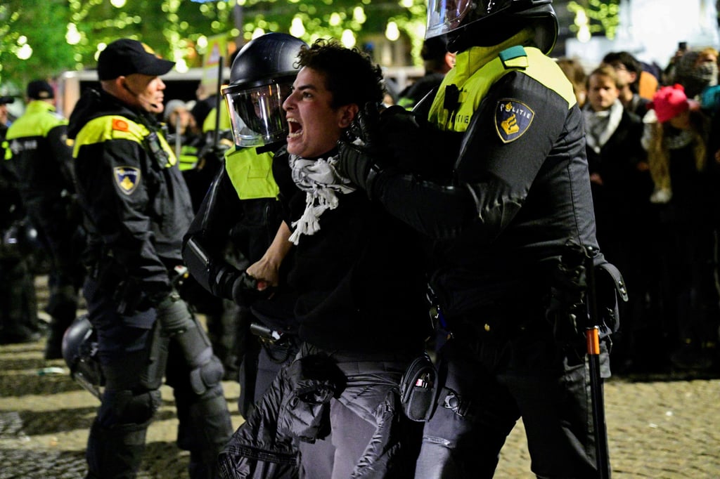 Police officers detain a protester during a pro-Palestinian demonstration in Amsterdam’s Dam Square on Wednesday. Photo: AFP