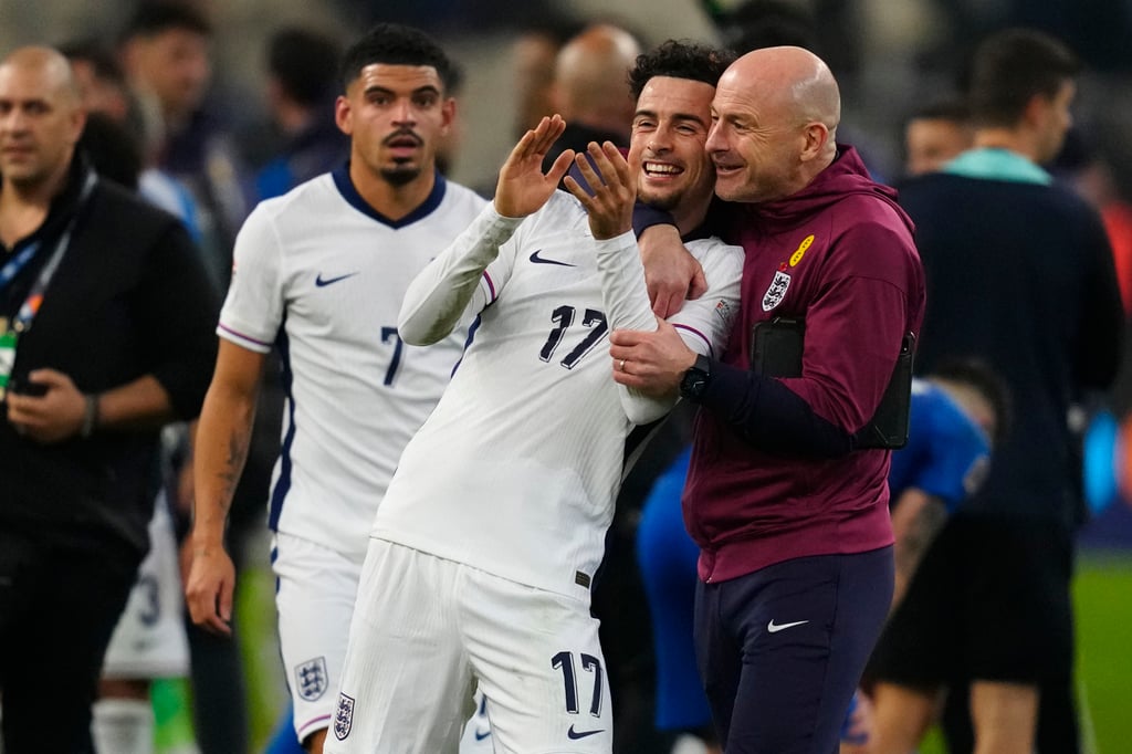 England’s manager Lee Carsley hugs Curtis Jones after the win in Athens. Photo: AP England’s manager Lee Carsley hugs Curtis Jones after the win in Athens. Photo: AP
