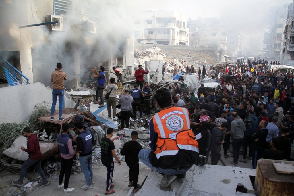 Palestinians inspect the damage at a school sheltering displaced people, after it was hit by an Israeli strike, in Gaza City. Photo: Reuters
