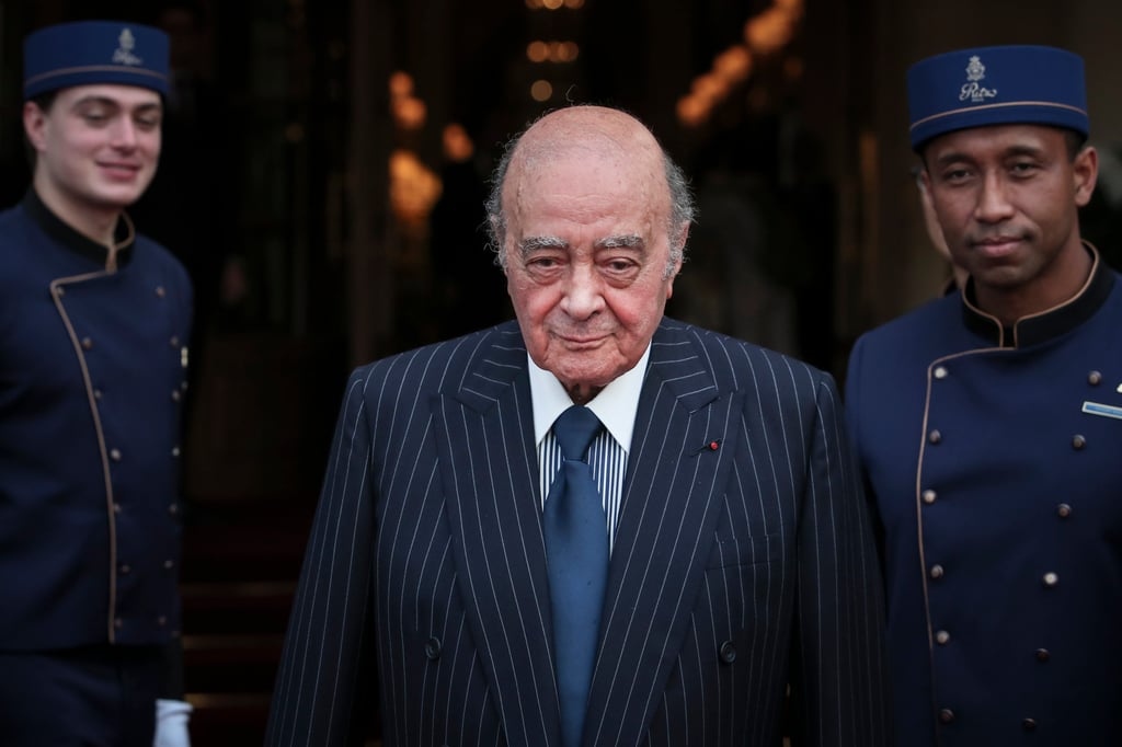 Egyptian businessman Mohammed al-Fayed poses with his hotel staff in Paris in June 2016. Photo: AP