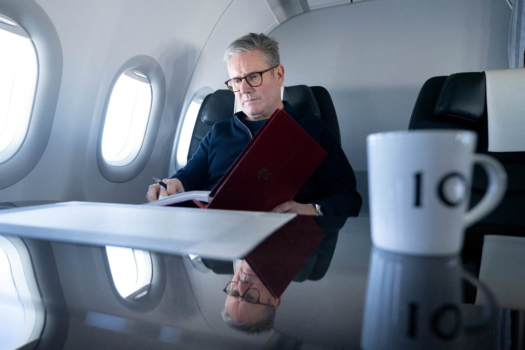 Prime Minister Sir Keir Starmer works on board a government plane on Sunday on his way to Rio de Janeiro, Brazil for the G20 summit. Photo: Pool/Reuters
