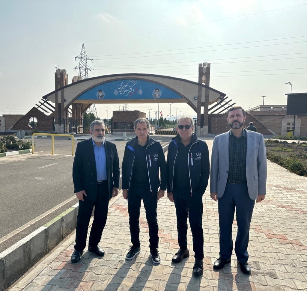 International Atomic Energy Agency (IAEA) Director General Rafael Grossi (second left) and the deputy chief of the Atomic Energy Organisation of Iran, Behrouz Kamalvandi (left), stand in front of the Fordow facility in Iran. Photo: International Atomic Energy Agency via Reuters