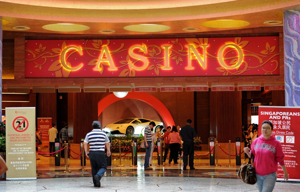 People gather near the entrance to the Resorts World Sentosa casino in Singapore. Photo: AFP