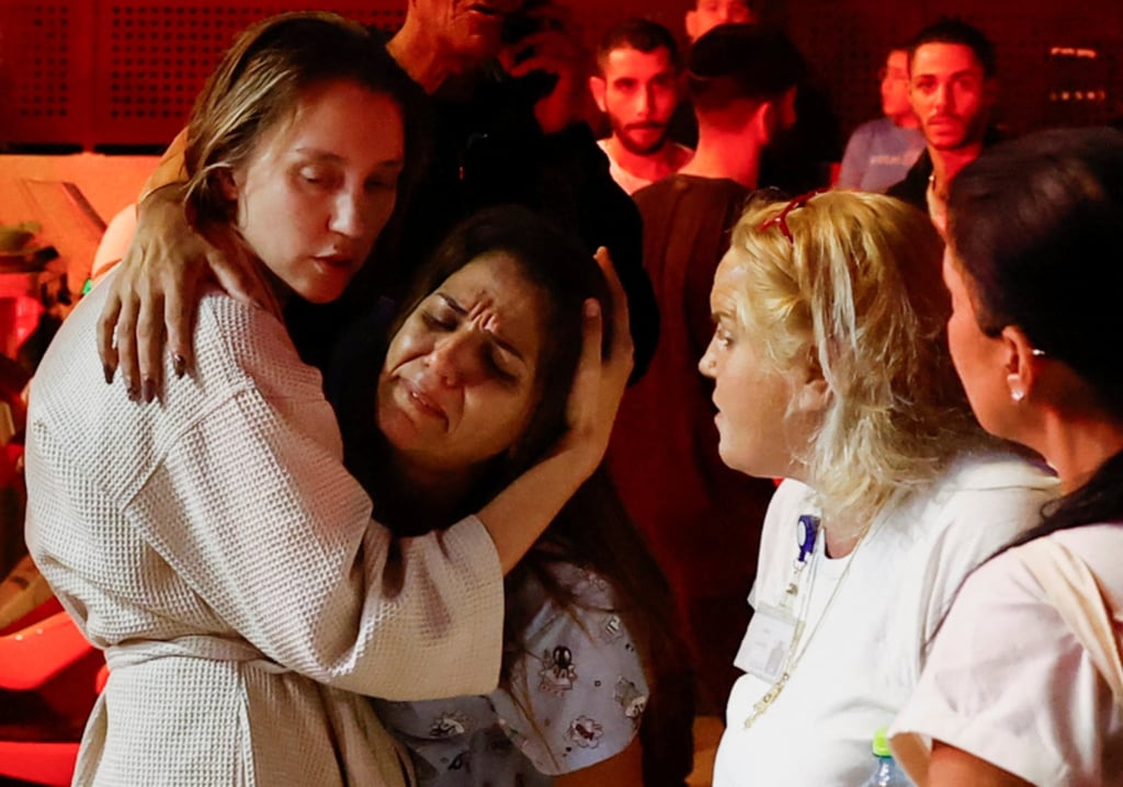 People react in Israel on November 12 following a barrage of projectiles fired from Lebanon. There has been more than a year of cross-border fire between Israel and Hezbollah over the Gaza conflict. Photo: Reuters People react in Israel on November 12 following a barrage of projectiles fired from Lebanon. There has been more than a year of cross-border fire between Israel and Hezbollah over the Gaza conflict. Photo: Reuters
