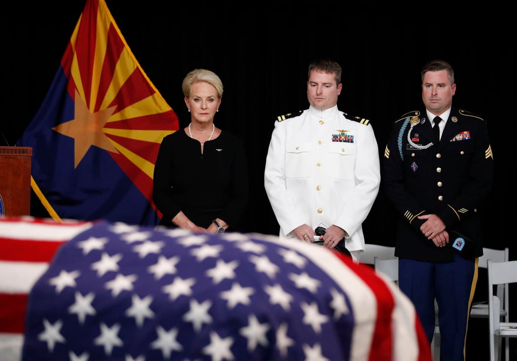 Cindy McCain in contemplation, with sons Jimmy (right) and Jack, during husband John’s funeral in Arizona in 2018. Photo: TNS Cindy McCain in contemplation, with sons Jimmy (right) and Jack, during husband John’s funeral in Arizona in 2018. Photo: TNS