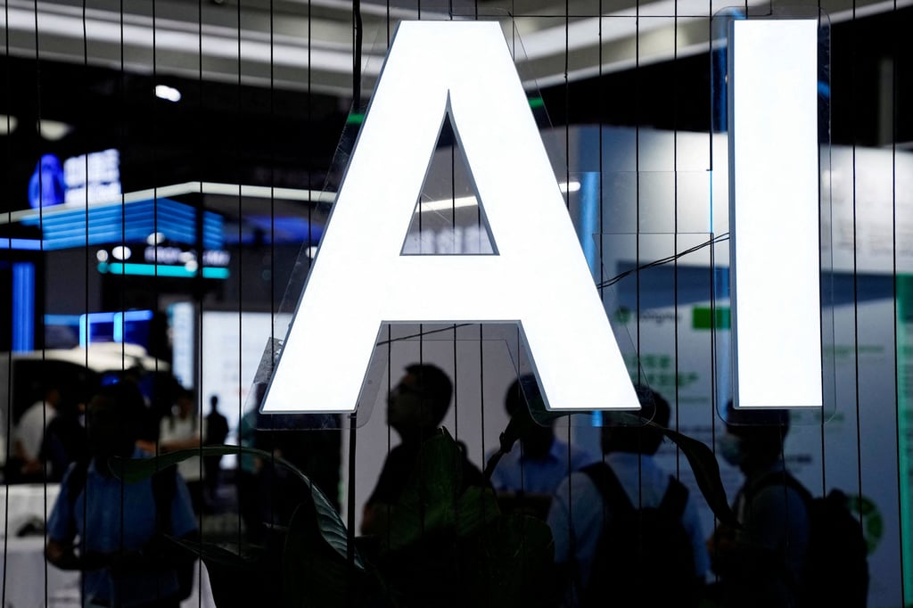 Attendees pass an AI sign at the World Artificial Intelligence Conference in Shanghai on July 6, 2023. Photo: Reuters