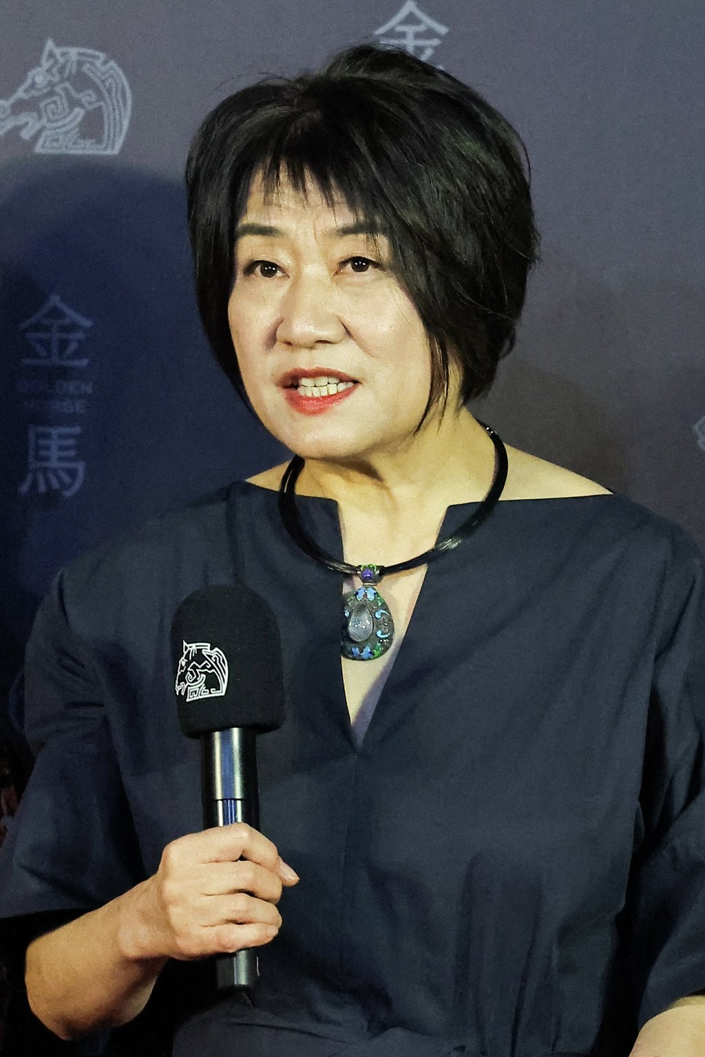Ma Yingli reads a message from her husband, Lou Ye, at the 61st Golden Horse Awards in Taipei after his film An Unfinished Film won best film and best director. Photo: Reuters Ma Yingli reads a message from her husband, Lou Ye, at the 61st Golden Horse Awards in Taipei after his film An Unfinished Film won best film and best director. Photo: Reuters