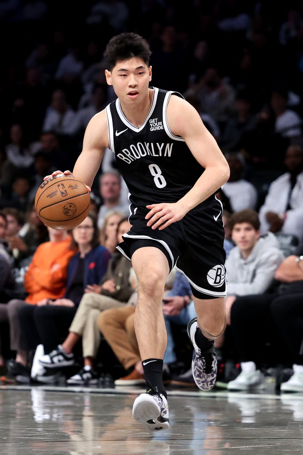 Cui Yongxi played his first NBA minutes for the Nets against the Milwaukee Bucks last month. Photo: AFP Cui Yongxi played his first NBA minutes for the Nets against the Milwaukee Bucks last month. Photo: AFP