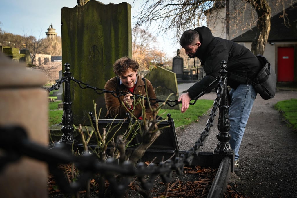 Sonny Murray leads a tour of Canongate Kirk, a 17th century church in Edinburgh where notable people are buried including Scottish economist Adam Smith and 18th century poet Robert Fergusson. Photo: AFP