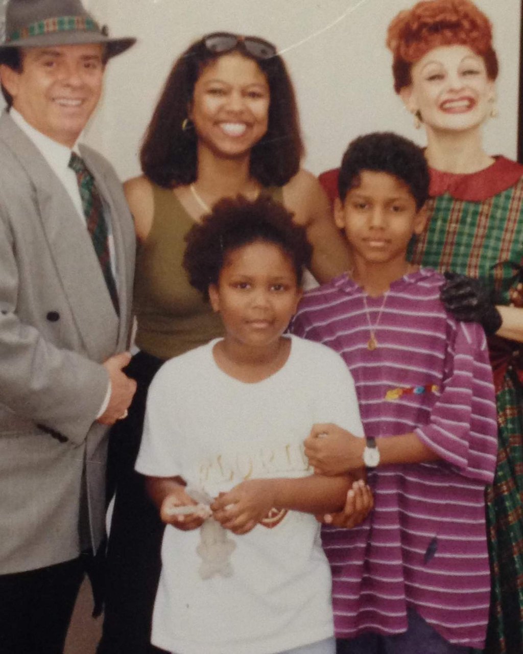 “Why is my mum the only one smiling?” Lizzo wrote in a post of an old photograph. Photo: @lizzobeeating/Instagram