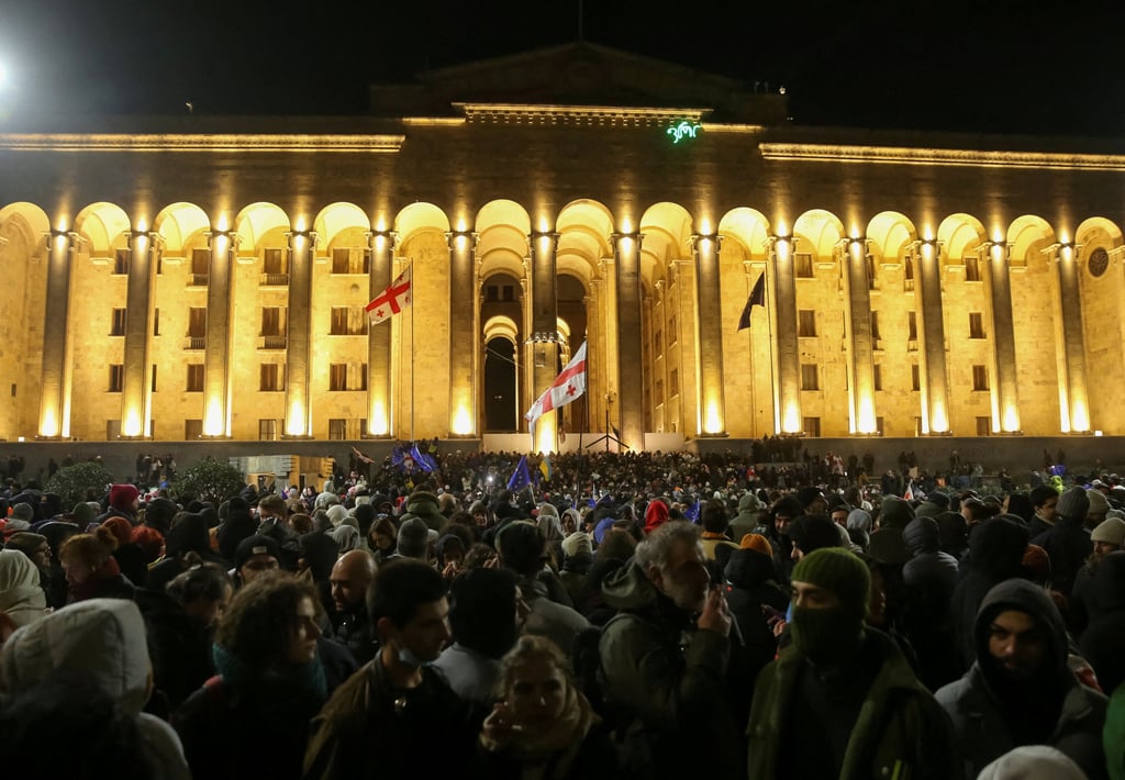 Supporters of Georgia’s opposition protest in front of the parliament building in Tbilisi. Photo: Reuters Supporters of Georgia’s opposition protest in front of the parliament building in Tbilisi. Photo: Reuters