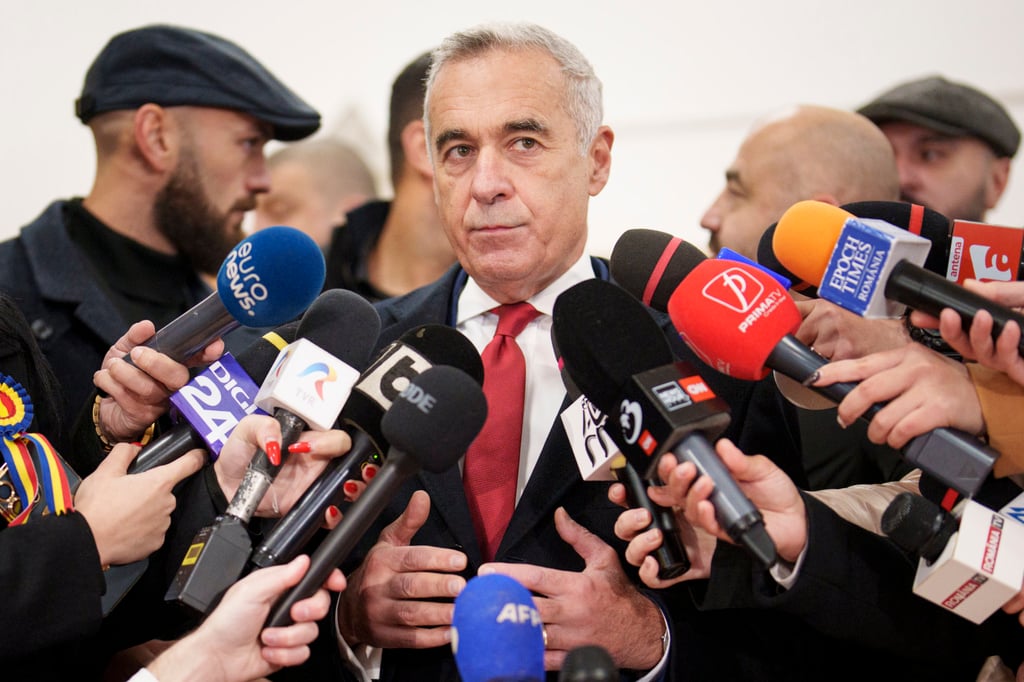 Independent presidential candidate Calin Georgescu speaks to the media after casting his vote in Romania’s parliamentary elections, in Mogosoaia, Romania on Sunday. Photo: AP Independent presidential candidate Calin Georgescu speaks to the media after casting his vote in Romania’s parliamentary elections, in Mogosoaia, Romania on Sunday. Photo: AP
