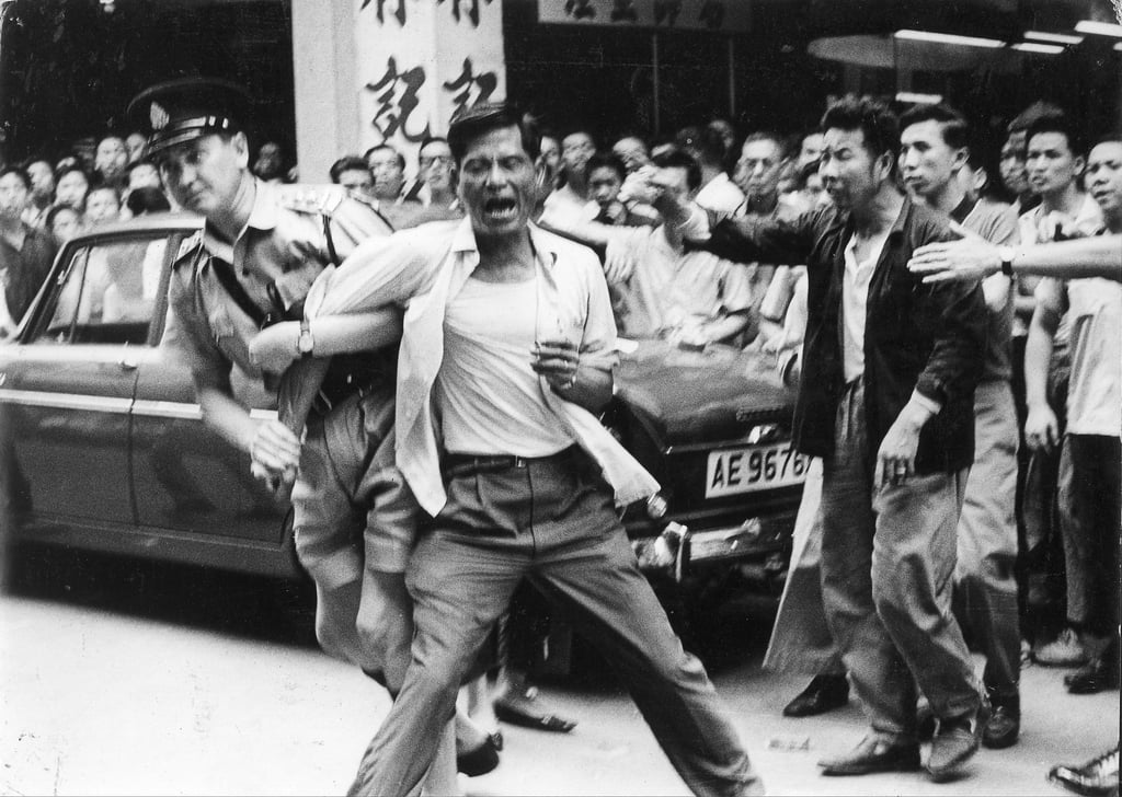 Angry depositors protest and clash with police outside the office of the chairman of the Canton Trust and Commercial Bank in 1965, the previous Year of the Wood Snake in the Chinese lunisolar calendar. Photo: Chan Kiu