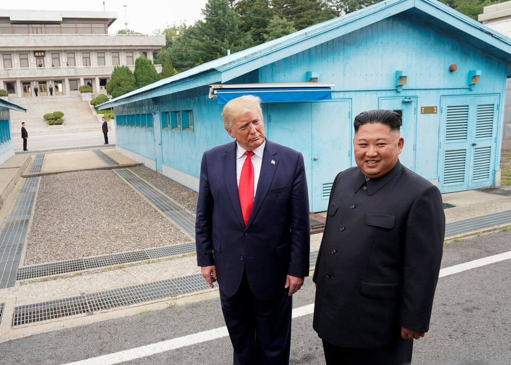 Former US president Donald Trump meets with North Korean leader Kim Jong-un at the demilitarised zone separating the two Koreas, in Panmunjom, South Korea on June 30, 2019. Photo: Reuters Former US president Donald Trump meets with North Korean leader Kim Jong-un at the demilitarised zone separating the two Koreas, in Panmunjom, South Korea on June 30, 2019. Photo: Reuters
