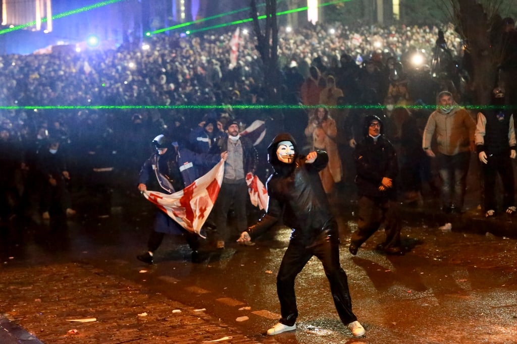 Demonstrators in Tbilisi, Georgia, on Sunday. Photo: AP Demonstrators in Tbilisi, Georgia, on Sunday. Photo: AP