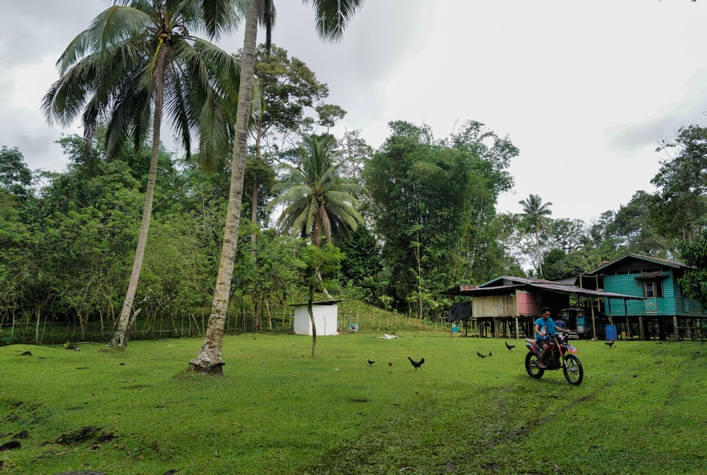 A resident riding a motorcycle near Patikul town, which was previously controlled by the Abu Sayyaf militant group. Photo: Jeoffrey Maitem A resident riding a motorcycle near Patikul town, which was previously controlled by the Abu Sayyaf militant group. Photo: Jeoffrey Maitem