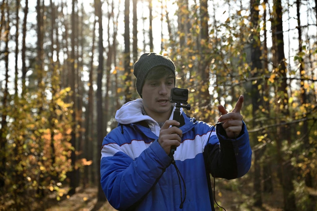During a tour in Irpin, Blasco Ventas films a video for his dark tourism YouTube channel, which has 115,000 subscribers. Photo: AFP