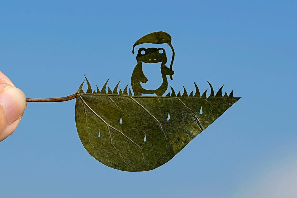 A piece by Lito featuring a frog holding a taro-leaf umbrella. Photo: AP A piece by Lito featuring a frog holding a taro-leaf umbrella. Photo: AP