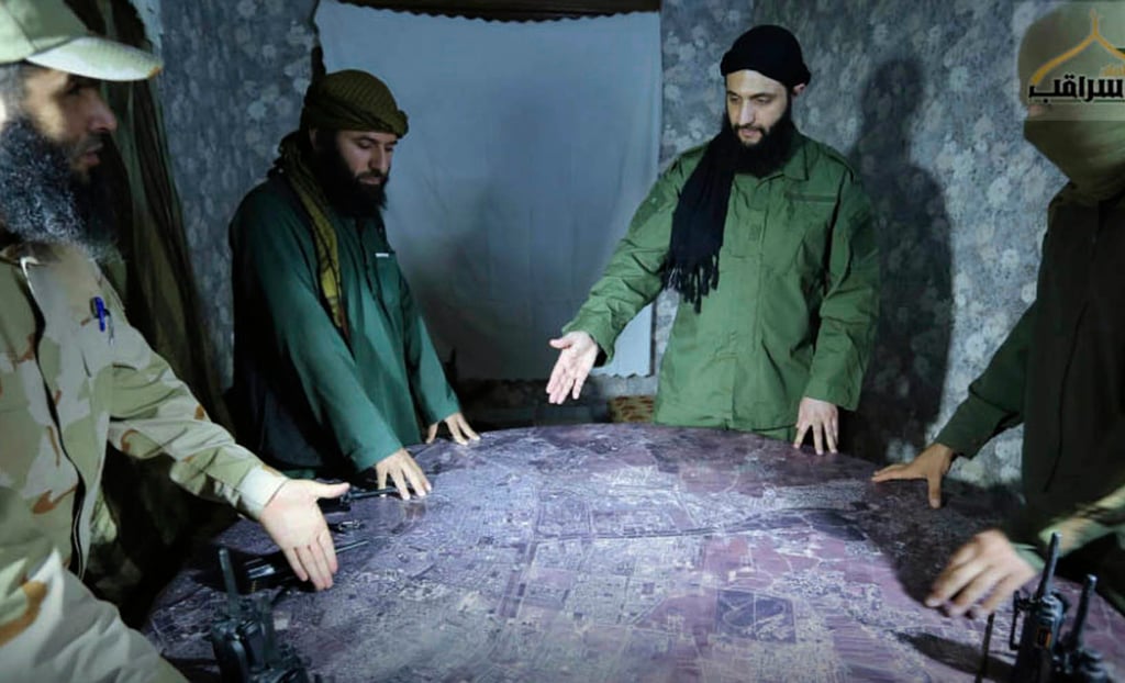 An undated photo released by a militant group in 2016 shows Abu Mohammed al-Golani, second from right, discussing battlefield details with commanders in Aleppo, Syria. File photo: Militant UGC via AP An undated photo released by a militant group in 2016 shows Abu Mohammed al-Golani, second from right, discussing battlefield details with commanders in Aleppo, Syria. File photo: Militant UGC via AP