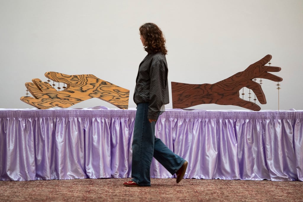 A woman walks past a piece by Jasleen Kaur during the Turner Prize 2024 press preview at the Tate Britain in London in September. Photo: AP A woman walks past a piece by Jasleen Kaur during the Turner Prize 2024 press preview at the Tate Britain in London in September. Photo: AP