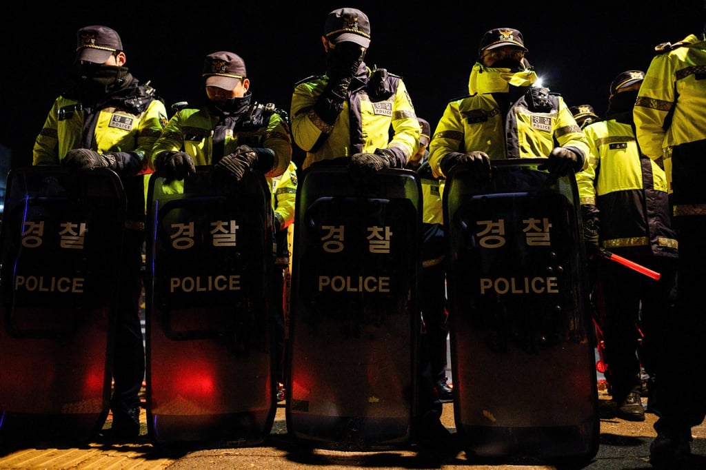 Police stand guard near the South Korean Presidential Office and Defence Ministry in Seoul early on Wednesday after Yoon Suk-yeol declared martial law. Photo: AFP
