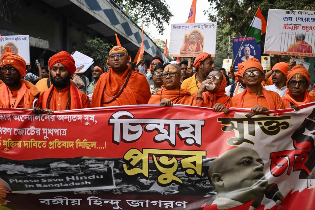 Hindu monks holding a banner take part in a protest rally near the Deputy High Commission of Bangladesh in Kolkata on November 28. Photo: AFP Hindu monks holding a banner take part in a protest rally near the Deputy High Commission of Bangladesh in Kolkata on November 28. Photo: AFP
