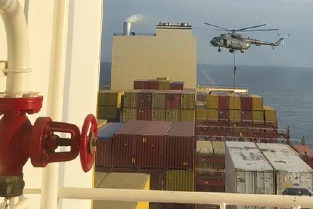 A helicopter raid targeting a vessel near the Strait of Hormuz in April. Photo: AP