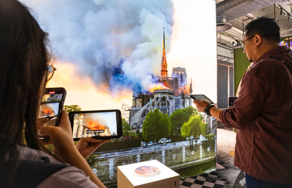 The Notre-Dame de Paris, The Augmented Exhibition takes visitors through the history of the iconic Paris cathedral, right up to its restoration following the 2019 fire. Photo: Alexander Mak The Notre-Dame de Paris, The Augmented Exhibition takes visitors through the history of the iconic Paris cathedral, right up to its restoration following the 2019 fire. Photo: Alexander Mak