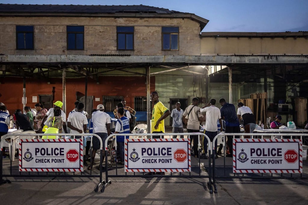 Officials from Electoral Commission Ghana count ballot papers at a polling station in Accra. Photo: AFP