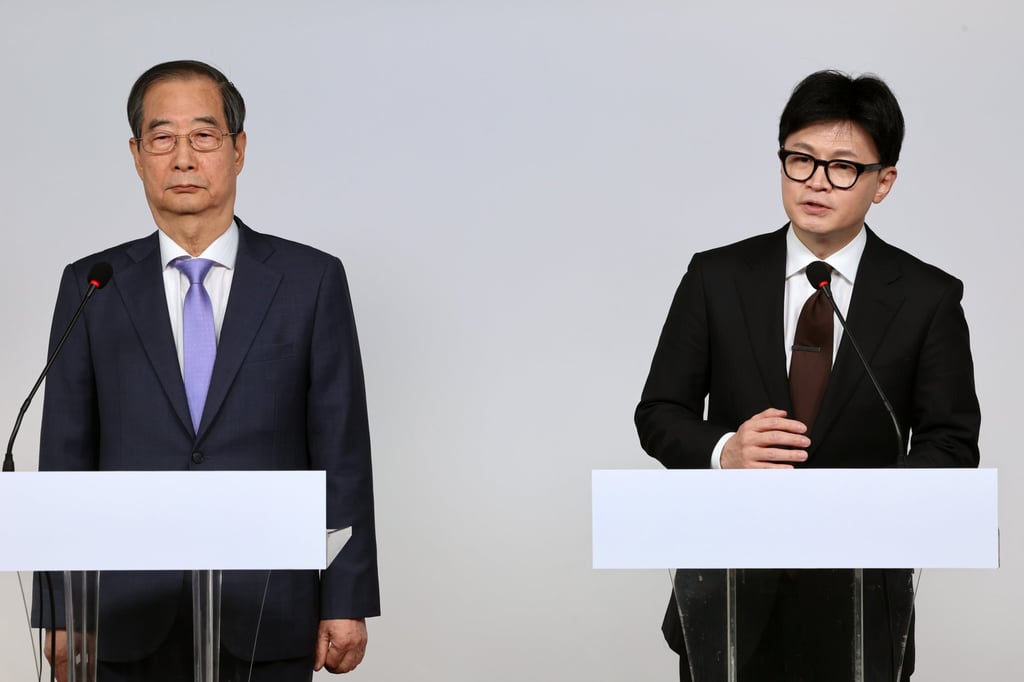 South Korean Prime Minister Han Duck-soo (left) and ruling People Power Party leader Han Dong-hoon deliver a joint public address a day after the parliamentary vote to impeach President Yoon for his martial law imposition failed. Photo: EPA-EFE