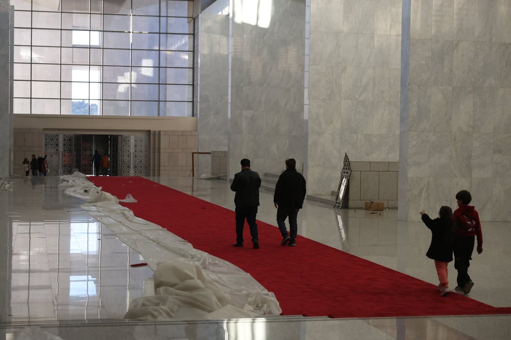 People inside the presidential palace after Syrian rebels took over Damascus on Sunday. Photo: EPA-EFE