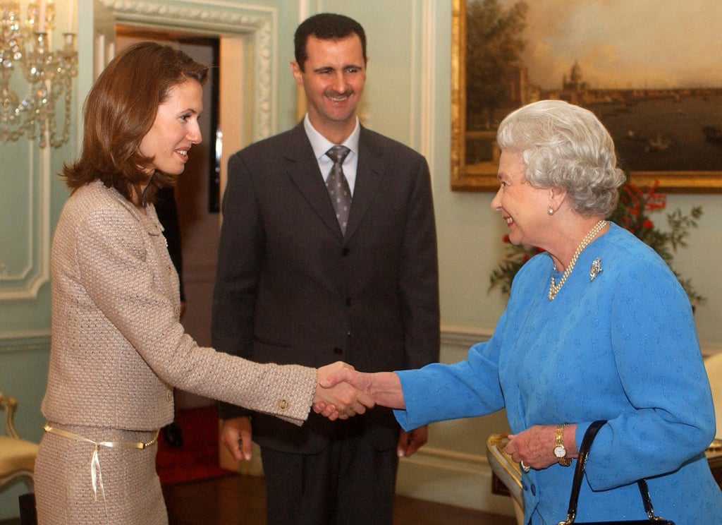 Queen Elizabeth receives Asma al-Assad and her husband, then Syria’s president Bashar al-Assad, on December 17, 2002, at Buckingham Palace, in London on their first visit to Britain. Photo: Pool/AFP Queen Elizabeth receives Asma al-Assad and her husband, then Syria’s president Bashar al-Assad, on December 17, 2002, at Buckingham Palace, in London on their first visit to Britain. Photo: Pool/AFP