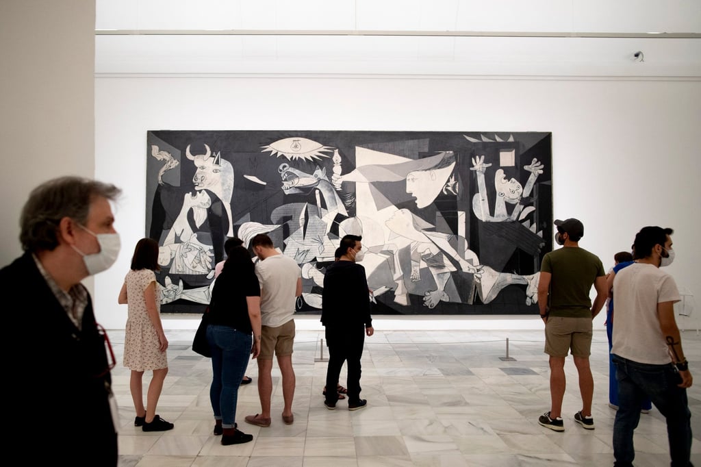 Visitors look at Pablo Picasso’s painting Guernica at the Reina Sofia museum in Madrid, Spain. Hong Kong’s planned events for 2025 include showcases of more than 60 masterpieces by the legendary Spanish artist at M+ from mid-March to mid-July, as well as a showing of 52 impressionist works by French masters Paul Cezanne and Pierre-Auguste Renoir at the Hong Kong Museum of Art from January 17 to May 7. Photo: AP Visitors look at Pablo Picasso’s painting Guernica at the Reina Sofia museum in Madrid, Spain. Hong Kong’s planned events for 2025 include showcases of more than 60 masterpieces by the legendary Spanish artist at M+ from mid-March to mid-July, as well as a showing of 52 impressionist works by French masters Paul Cezanne and Pierre-Auguste Renoir at the Hong Kong Museum of Art from January 17 to May 7. Photo: AP