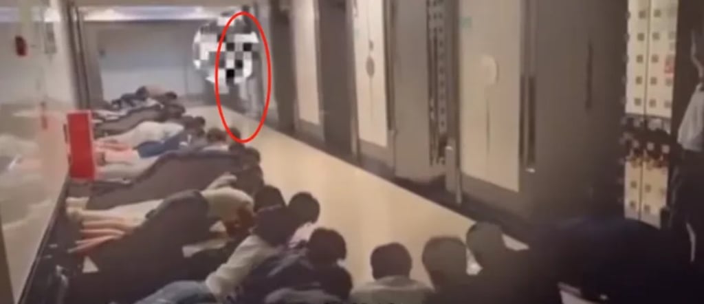 A viral video of staff lying in a corridor to greet their boss has sparked concerns about toxic culture in China, though a company rep claims it was fake. Photo: Douyin